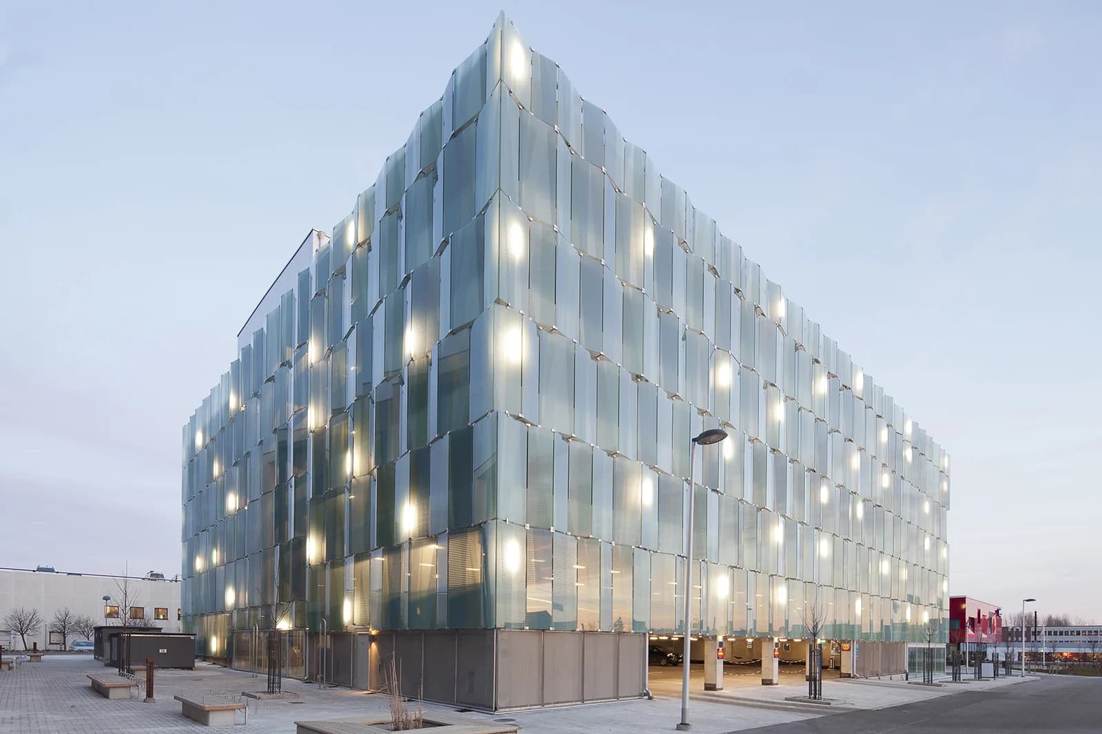 Glass-clad building corner at dusk