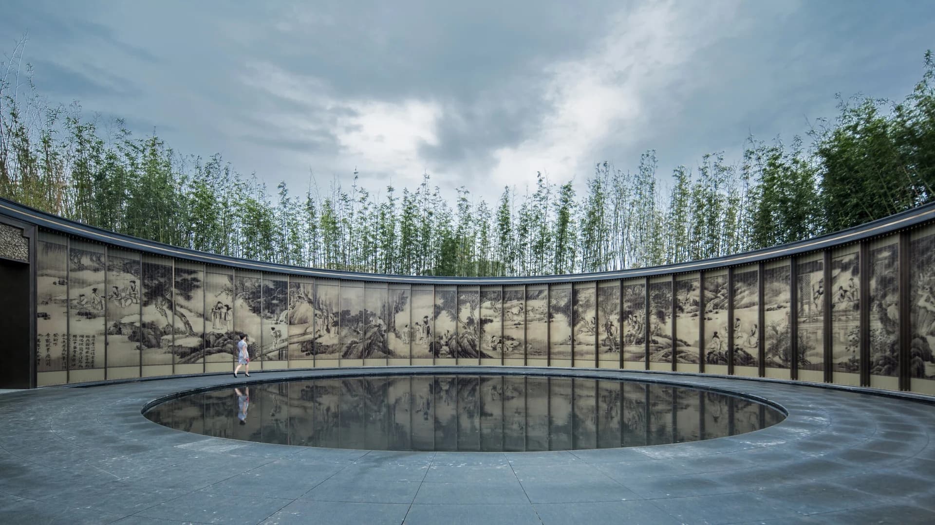 Curved glass wall and reflecting pool