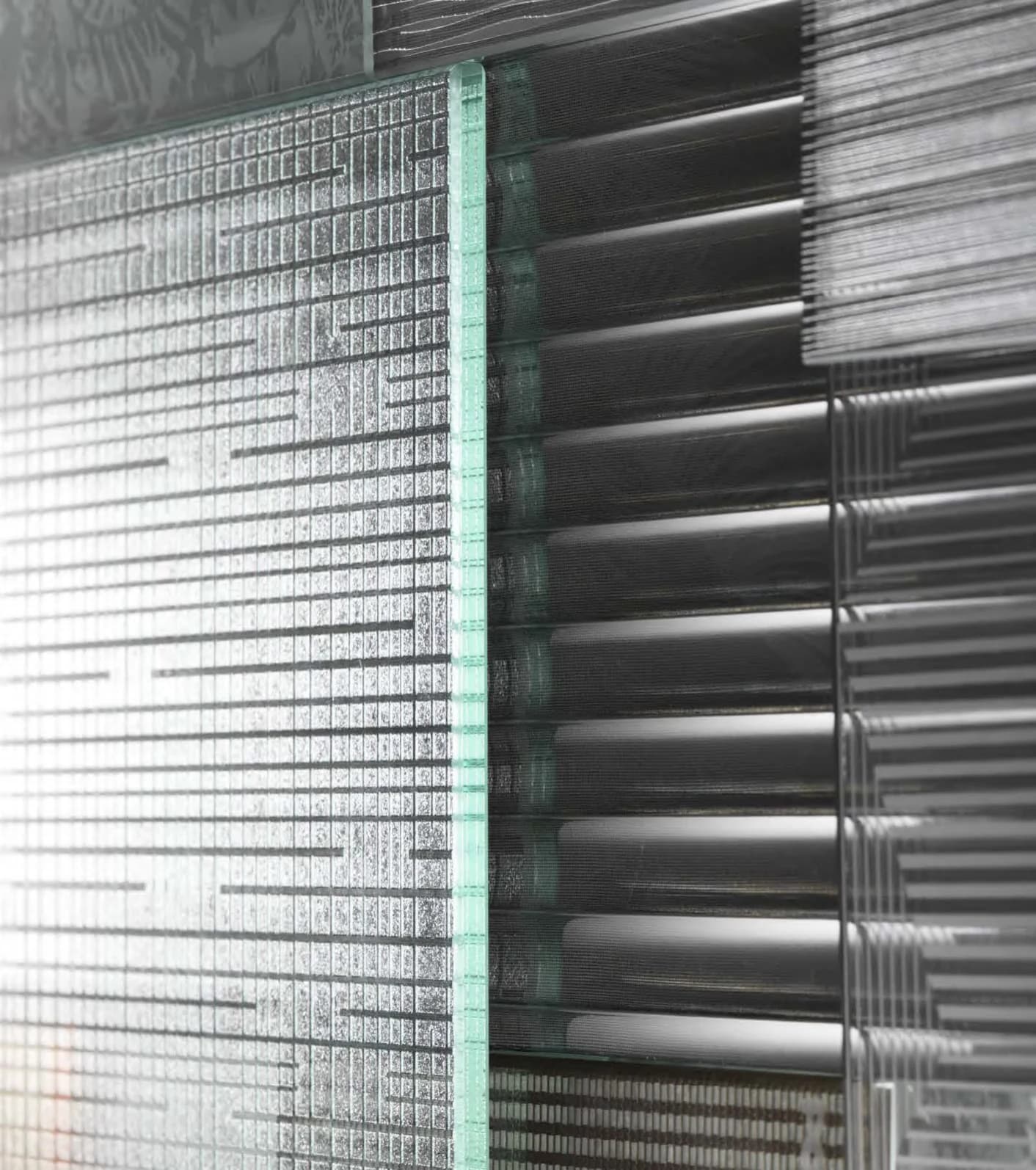 The green edge of textured glass against a layered pattern