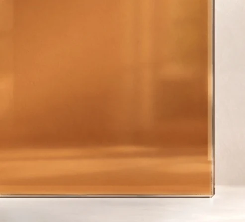 Amber glass sample against a pale background
