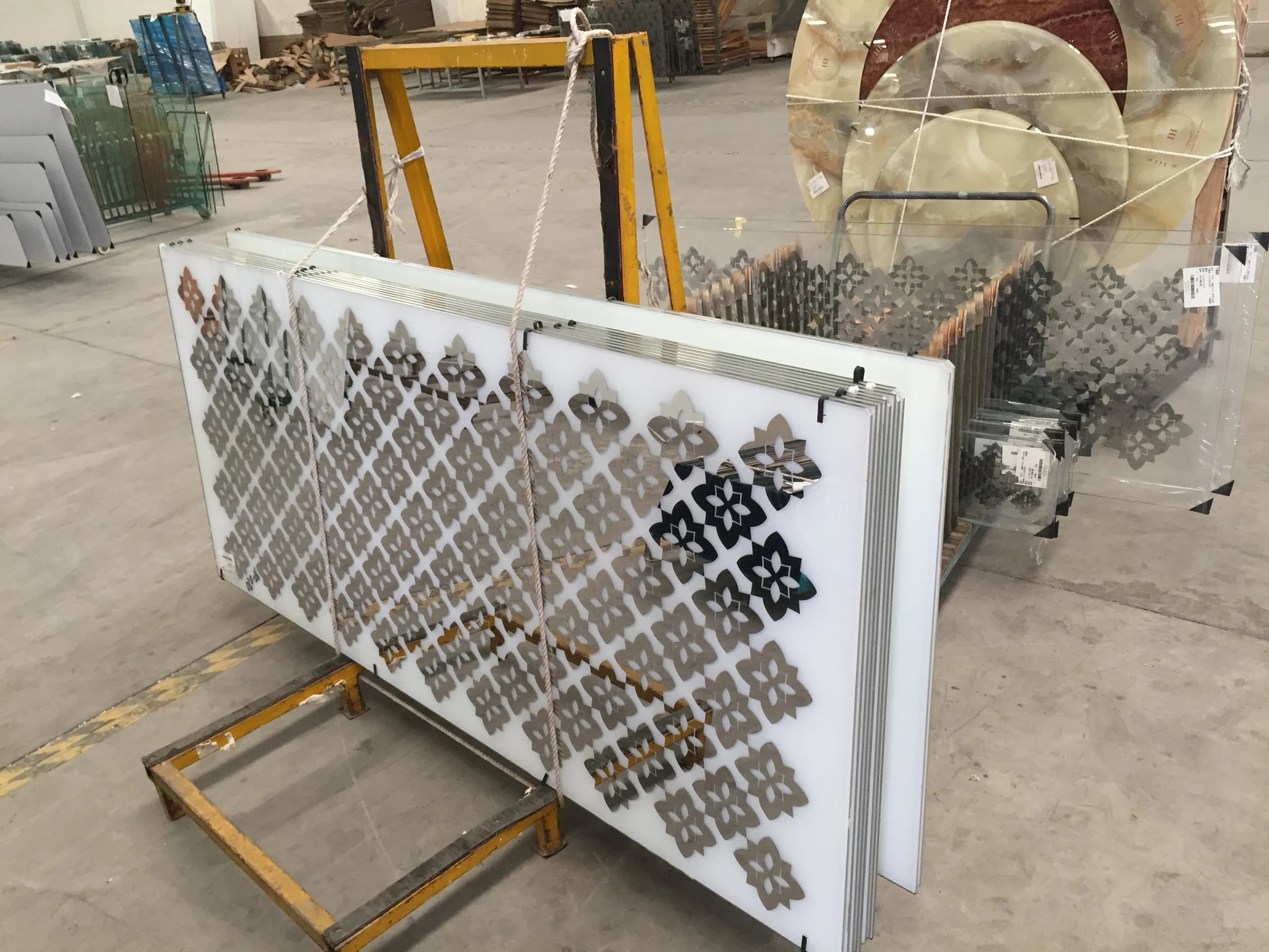Geometric glass panels on a workshop rack in the Orient project archive