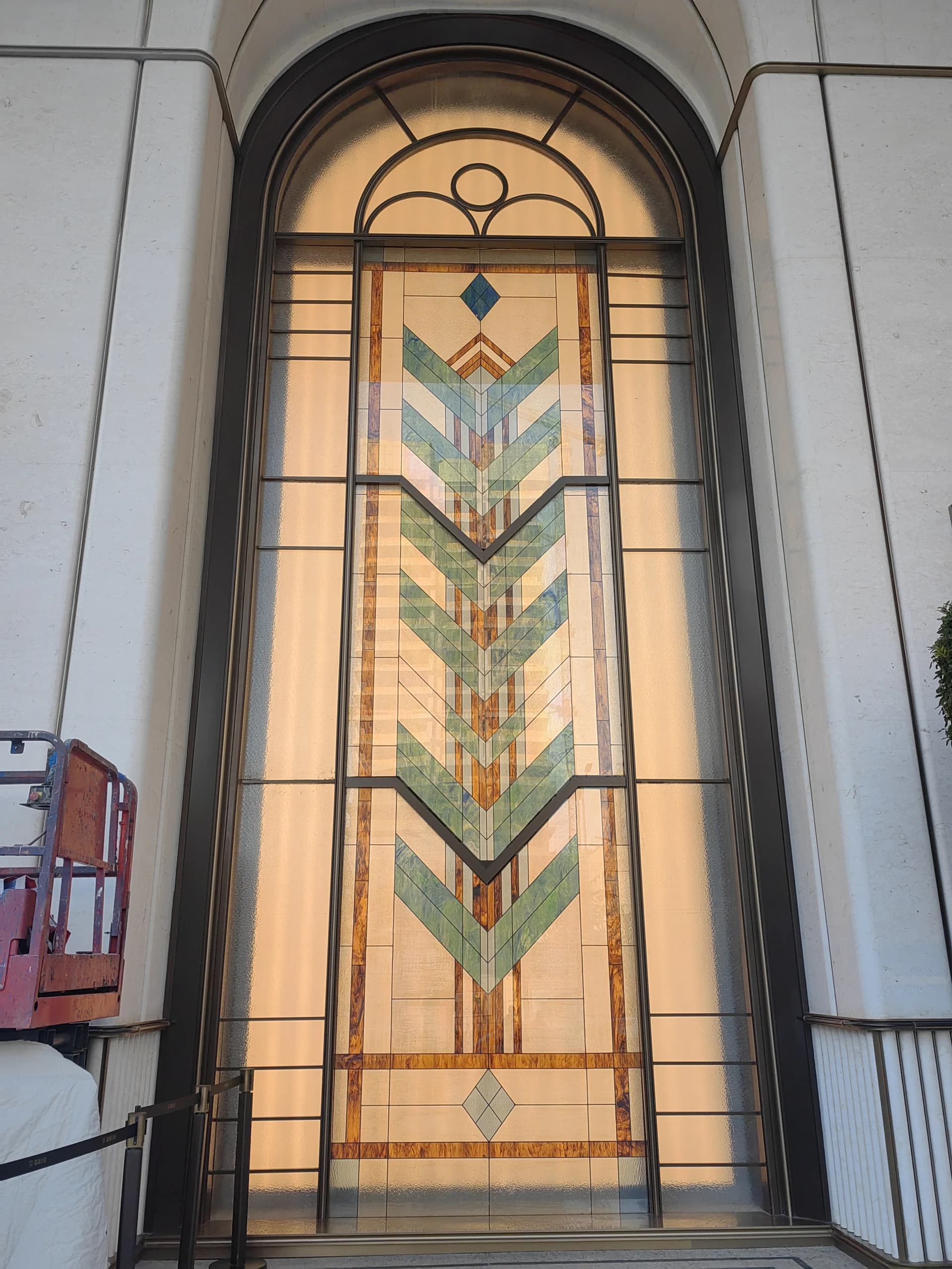A tall decorative glass doorway, supplied with phase one