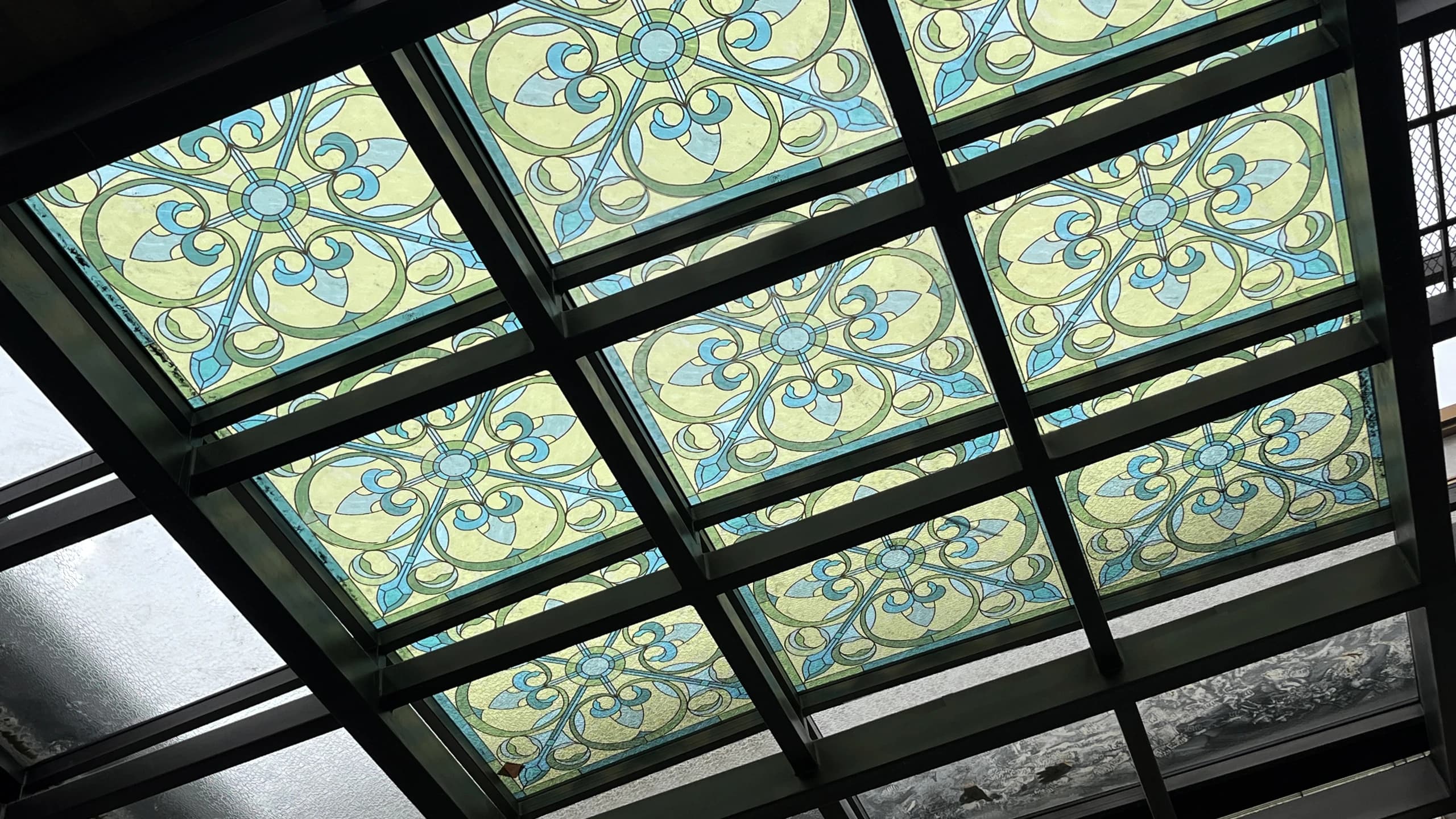 Patterned glass seen beneath a glazed roof, supplied with phase one