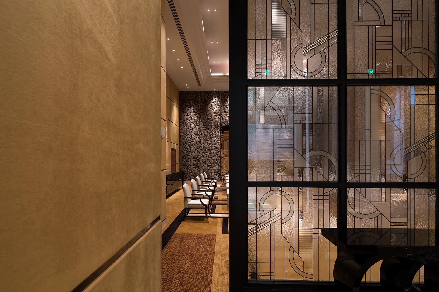 Framed patterned glass alongside a warm interior at Four Seasons Tianjin