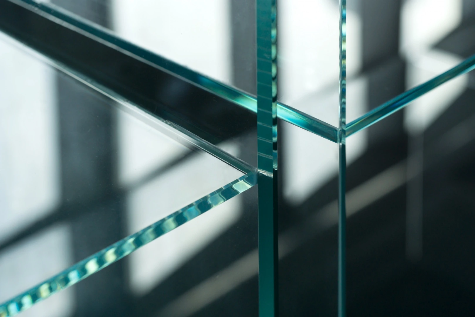 An architectural material study of intersecting glass planes and finished edges