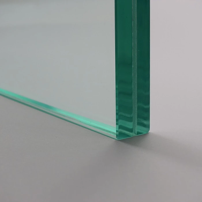 Two glass layers and their interlayer visible at the corner of a laminated sample